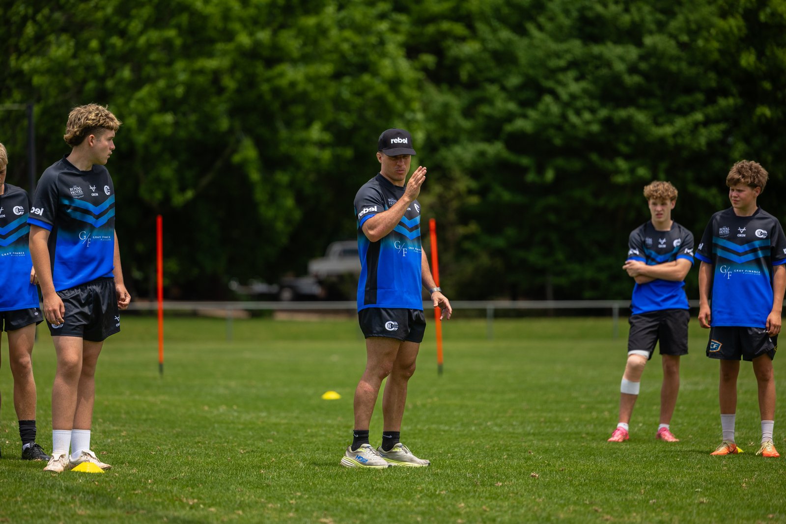 Brodie Croft coaching junior rugby league players on the field at a Triple C Academy session