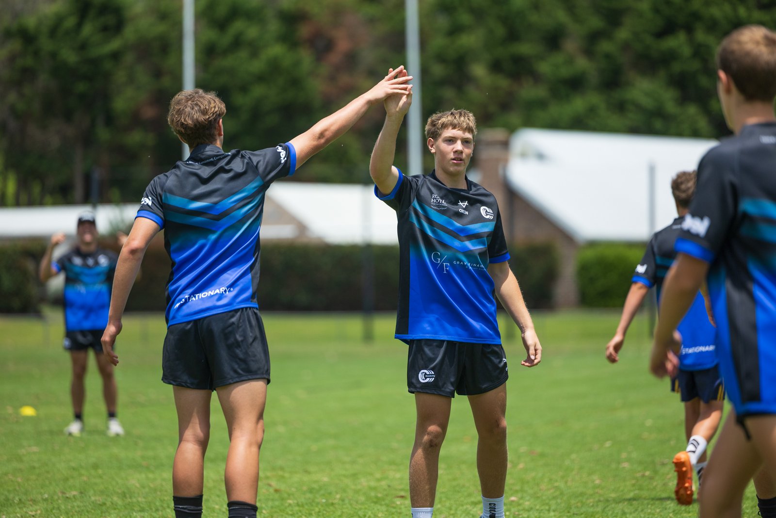 Triple C Academy players celebrating together on the field